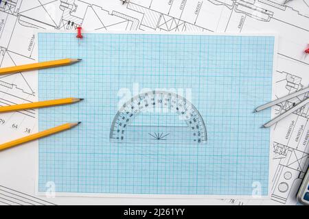 Technical drawing, graph paper and tools. Engineer  office team working with blueprints. Stock Photo