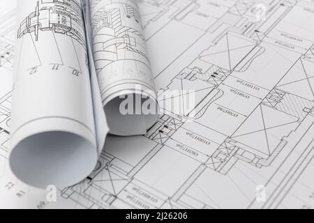 Technical drawings with blueprints in rolls close up. Engineering concept Stock Photo