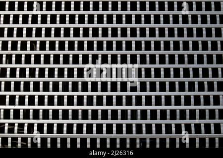 industrial storehouse with closed gray metal roller shutter Stock Photo