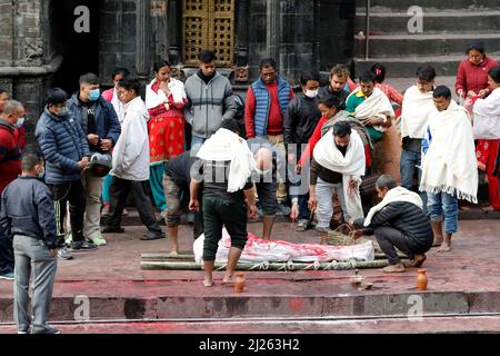 Hindu cremation process in progress at a temple in Pashupatinath. Stock Photo