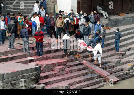 Hindu cremation process in progress at a temple in Pashupatinath. Stock Photo