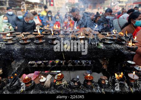 Oil or butter lamps burning in Hindu  temple. Stock Photo