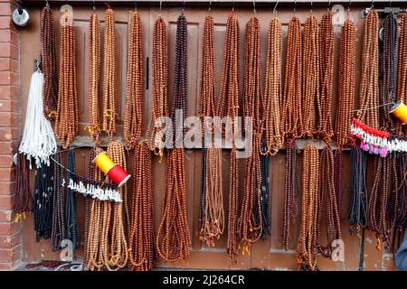 Mala or buddhist prayer beads for sale at market. Stock Photo