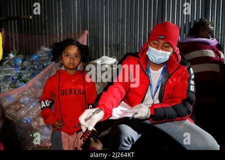 Night marauding in the street of Katmandu.  Distribution of medicines. Stock Photo