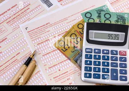 Australian tax form with pen, calculator and australian dollars Stock Photo