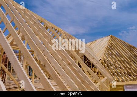 Wooden roof trusses to a timber frame house under construction Stock Photo