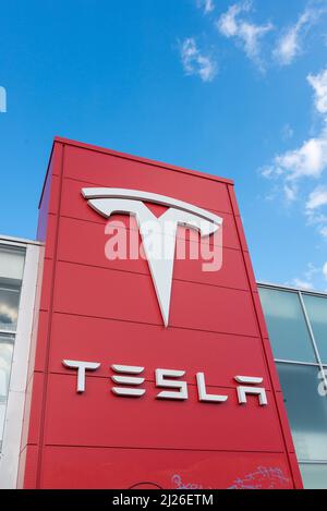 Large Tesla sign outside a Tesla dealership in Digbeth, Birmingham, UK Stock Photo