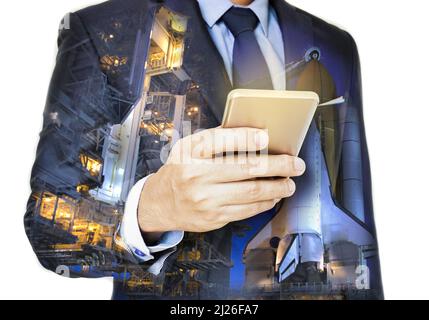 Double exposure of hand hold  smart phone with spaceport  .Elements of this image furnished by NASA Stock Photo