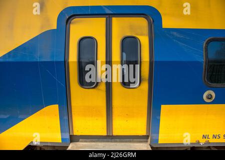 Amsterdam, Netherlands, March 2022. Open and closed doors of a dutch train. High quality photo Stock Photo