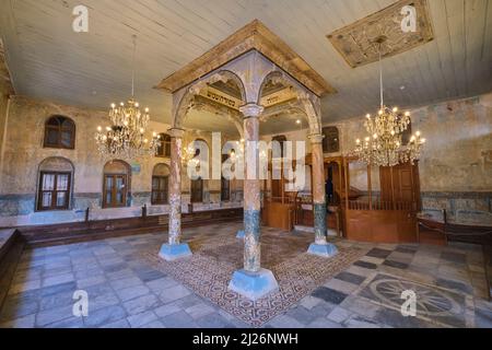 The synagogue space, with central bima. Restoration stripped past paint jobs. At the Etz Hayim synagogue, now an art exhibition space,  in Izmir, Turk Stock Photo