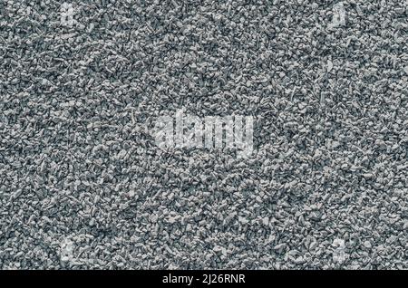Gray fine gravel. Stone background. Extraction of natural materials. Stock Photo