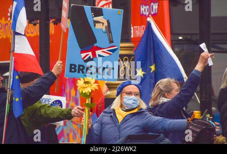 London, UK. 30th March 2022. A protester holds an anti-Brexit placard. Anti-Boris Johnson, anti-Tory and anti-Brexit protesters gathered in Parliament Square as Johnson faced Prime Minister's Questions amidst fines for the Partygate scandal. Credit: Vuk Valcic/Alamy Live News Stock Photo