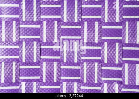 weaving white and purple violet plastic pattern. Minimalist fun summer background Stock Photo