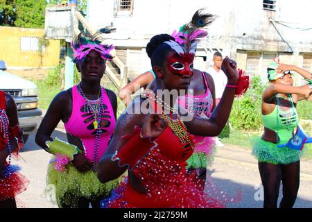 PUNTA GORDA, BELIZE - SEPTEMBER 10, 2015 St. George’s Caye Day celebrations and carnival multicoloured dancers Stock Photo