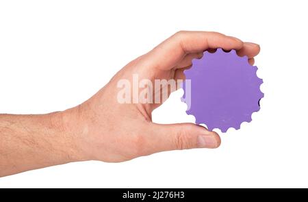 Application settings. Man holding gear isolated on white background. Hand with violet cog wheel. High quality photo Stock Photo