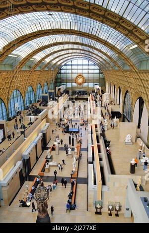 Paris, France - March 22, 2022: Visitors at the Musee d'Orsay in Paris. Located in the former Gare d'Orsay train station, the museum has a large colle Stock Photo