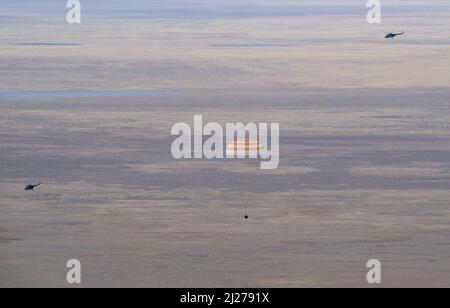 Zhezkazgan, Kazakhstan. 30th Mar, 2022. The Soyuz MS-19 spacecraft is seen as it lands in a remote area near the town of Zhezkazgan, Kazakhstan with Expedition 66 crew members Mark Vande Hei of NASA, and cosmonauts Pyotr Dubrov, and Anton Shkaplerov of Roscosmos, Wednesday, March 30, 2022. Vande Hei and Dubrov are returning to Earth after logging 355 days in space as members of Expeditions 64-66 aboard the International Space Station. Credit: dpa picture alliance/Alamy Live News Stock Photo