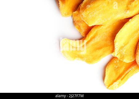 Dried mango sliced on a white background with free space Stock Photo