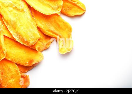 Dried mango sliced on a white background with free space Stock Photo