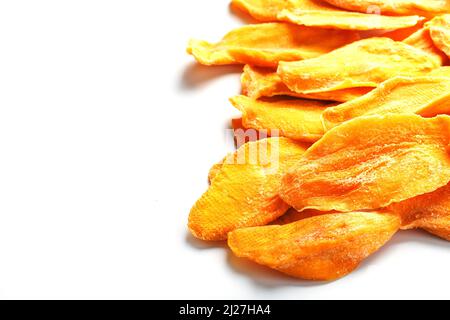 Dried mango sliced on a white background with free space Stock Photo