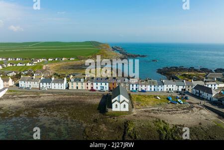 Aerial view from drone of row of houses in Isle of Whithorn village and harbour  in Dumfries and Galloway, Scotland, UK Stock Photo