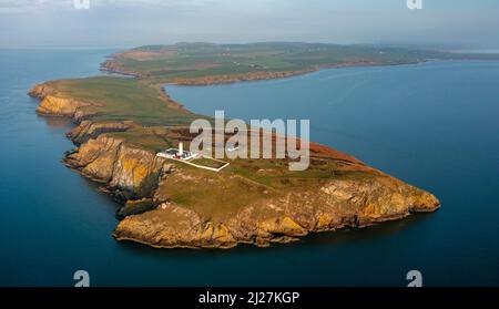 Aerial view at sunrise of Mull of Galloway Lighthouse at southern most point in Scotland, in Dumfries and Galloway, Scotland, UK Stock Photo