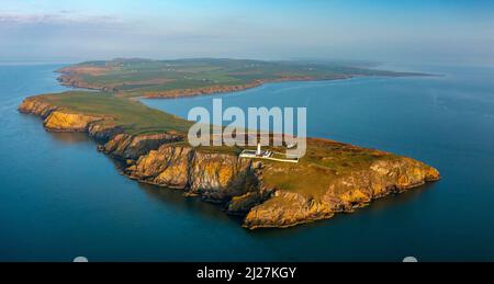 Aerial view at sunrise of Mull of Galloway Lighthouse at southern most point in Scotland, in Dumfries and Galloway, Scotland, UK Stock Photo