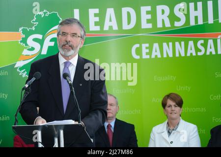 05/04/2010 Belfast, Northern Ireland.  Sinn Fein president Gerry Adams launches the party manifesto in advance of the 2010 Northern Ireland Assembly elections.  Martin McGuinness and Catriona Ruane behind. Stock Photo