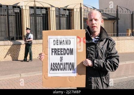 03/05/2010, Belfast, Northern Ireland. Veteran Republican Tony Catney is among a number holding a 'White Line Protest' in the middle of the Falls Road, calling for the end of prison brutality at HMP Maghaberry. Stock Photo