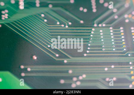 Close-up of a green printed circuit board. Not populated, no components Stock Photo