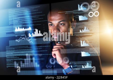 Sifting through streams of data. Cropped shot of a young male programmer sifting through data streams while coding. Stock Photo