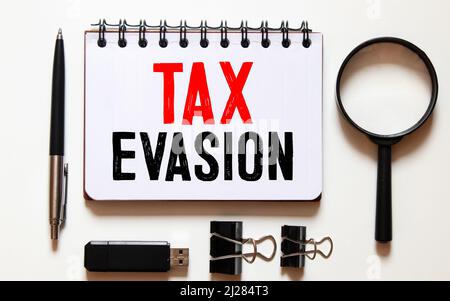 Conceptual hand writing showing Tax Evasion. Business photo text the failure to pay or the deliberate underpayment of taxes Corkboard size paper thumb Stock Photo