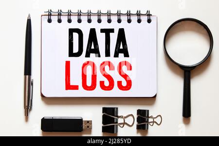 Word writing text Data Loss. Business concept for process or event that results in data being corrupted and deleted Colored crumpled papers empty remi Stock Photo