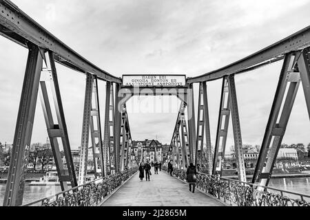 Frankfurt, Germany - January 9, 2019: pedestrian bridge crossing river Main called iron Bridge (eiserner Steg) in Frankfurt, Germany Stock Photo