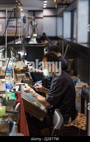 Thai Jeweler making fine Jewelry in a workshop Stock Photo