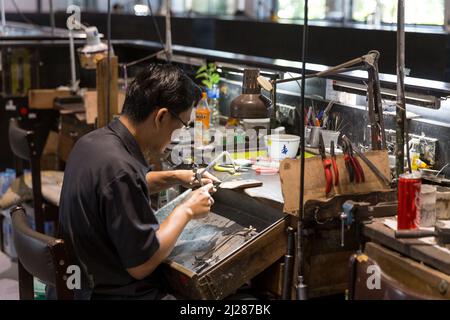 Thai Jeweler making fine Jewelry in a workshop Stock Photo