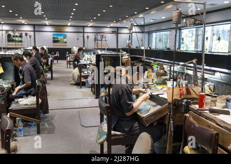 Thai Jeweler making fine Jewelry in a workshop Stock Photo