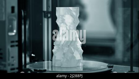 The object in the form of a blue vase stands on the desktop Stock Photo