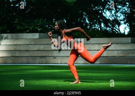 Beautiful young woman runner outdoor in sport outfit stretching personal  trainer sports gym Stock Photo - Alamy