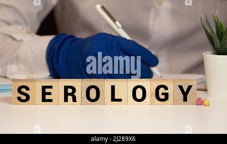 Macro, HIV and AIDS crossword puzzle over HIV strip test in background Stock Photo