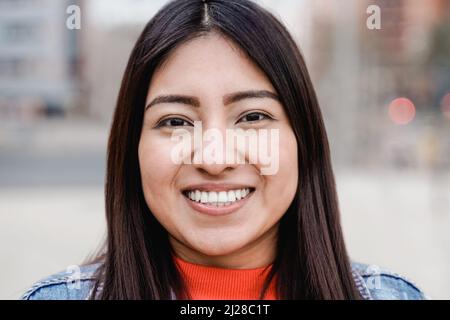 Native american happy girl smiling on camera outdoor - Focus on face Stock Photo