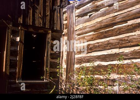 MT: Jefferson County, Boulder Valley, Elkhorn (ghost town), Abandoned log cabins in this ghost town [Ask for #170.039.] Stock Photo