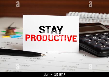Conceptual hand writing showing Stay Productive Motivational Call. Business photo text Efficiency Concentration Productivity Words written Note Desk P Stock Photo