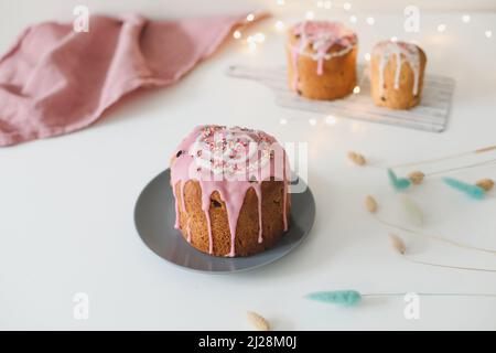 Easter cake, colorful eggs and willow branches on light background. Happy Easter holiday concept. festive spring season Stock Photo