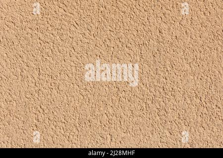 Texture of a yellow ochre wall external render. High quality background. Stock Photo