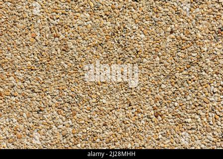Yellow gravel texture of a slab from above. High quality background. Stock Photo