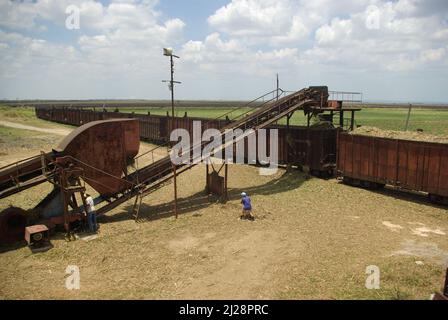 Chambas, Cuba, April 25, 2010. Loading sugar cane into train carriages. Stock Photo