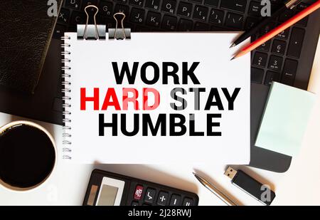 Work Hard Stay Humble Text written on notebook page, red pencil on the right. Motivational Concept image Stock Photo