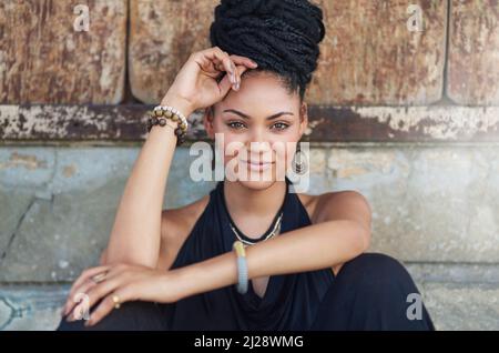 Matching beauty and style. Portrait of an attractive young woman posing outdoors. Stock Photo