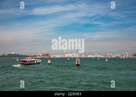 Venice, Italy - July 5, 2021:  the ferry on the way to Venice with view to St. Mark's square. Stock Photo